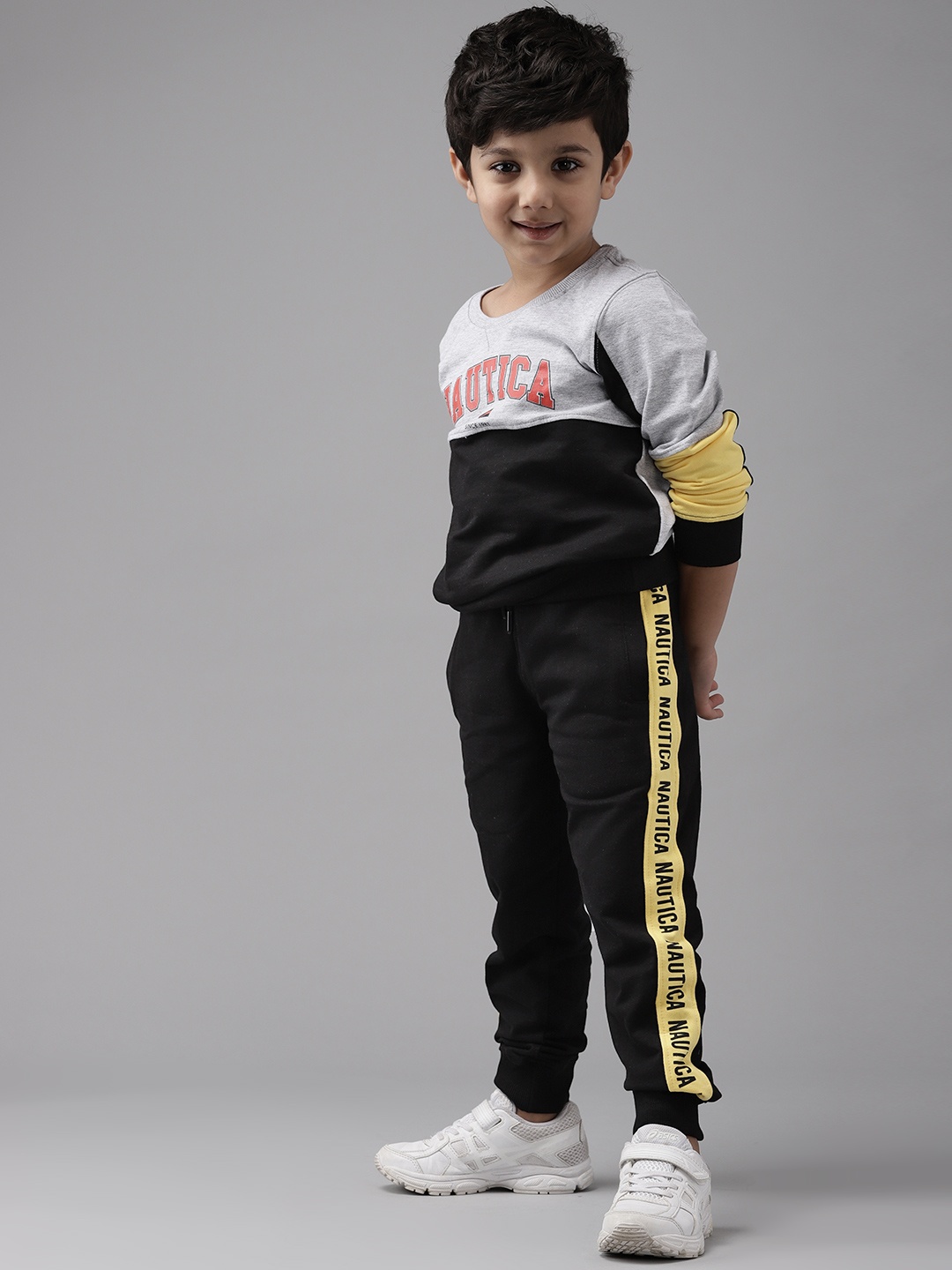 

Nautica Boys Black & Yellow Cotton Solid Joggers with Side Taping