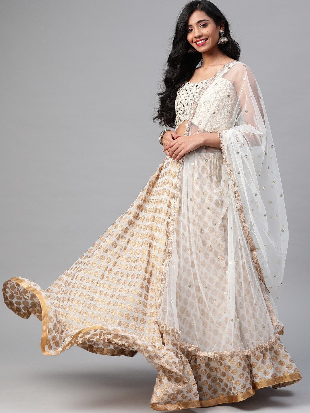 

SHUBHVASTRA Off White & Golden Embellished Semi-Stitched Lehenga & Unstitched Blouse With