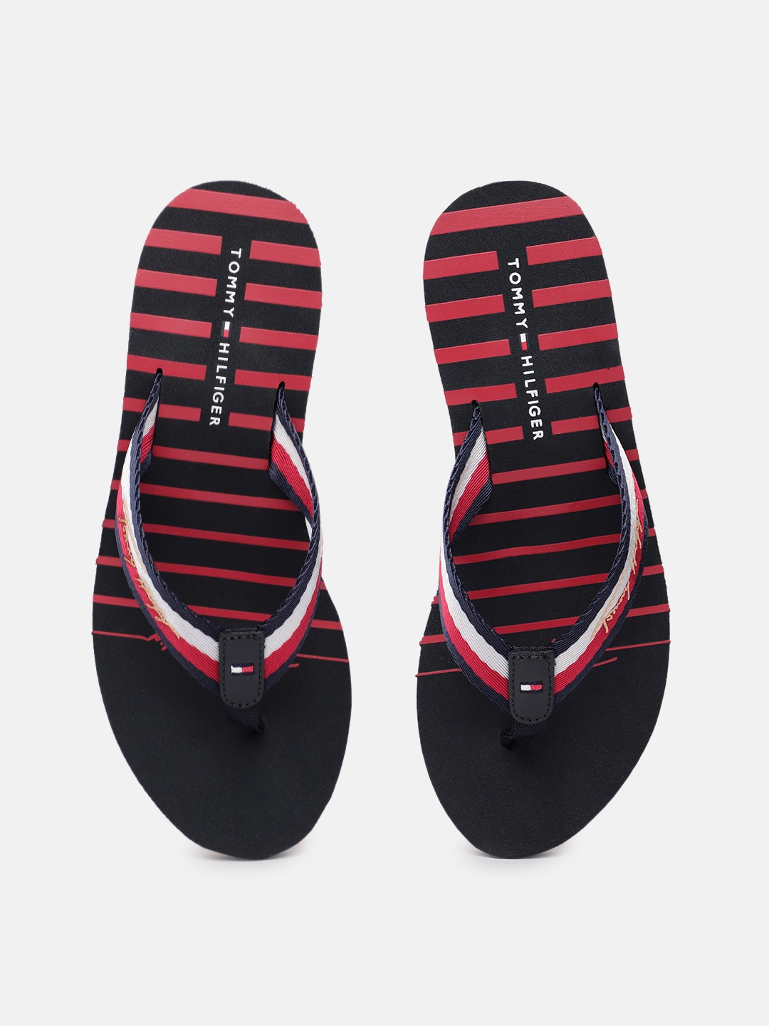 

Tommy Hilfiger Women Navy Blue & White Striped High Wedge Thong Flip-Flops