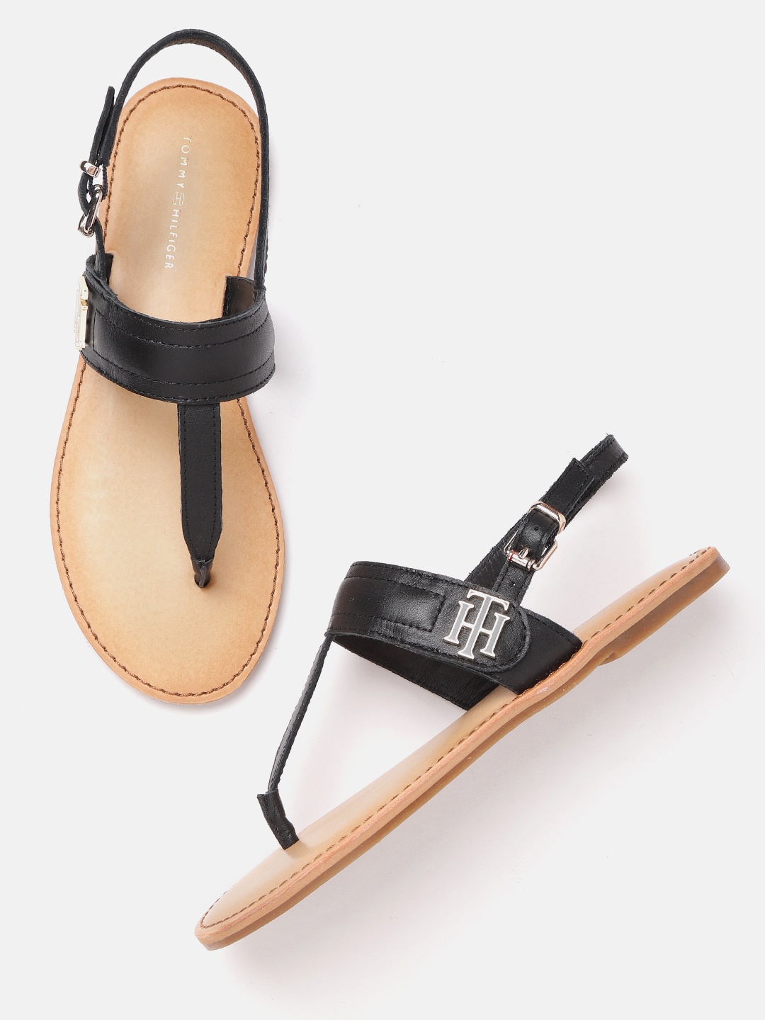 

Tommy Hilfiger Women Black Solid Leather T-Strap Flats with Metallic Detail
