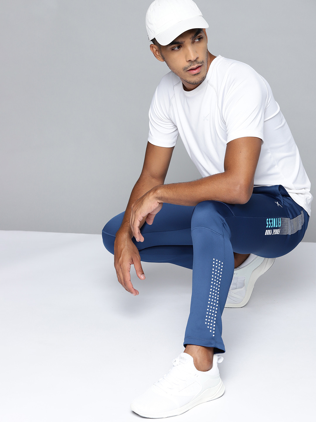 

HRX By Hrithik Roshan Men Blue Typographic Slim Fit Rapid-Dry Training Track Pants, Navy blue