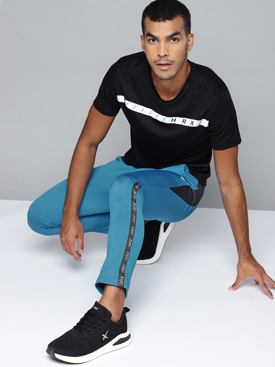 

HRX By Hrithik Roshan Men Blue Slim Fit Mid-Rise Rapid-Dry Training Track Pants