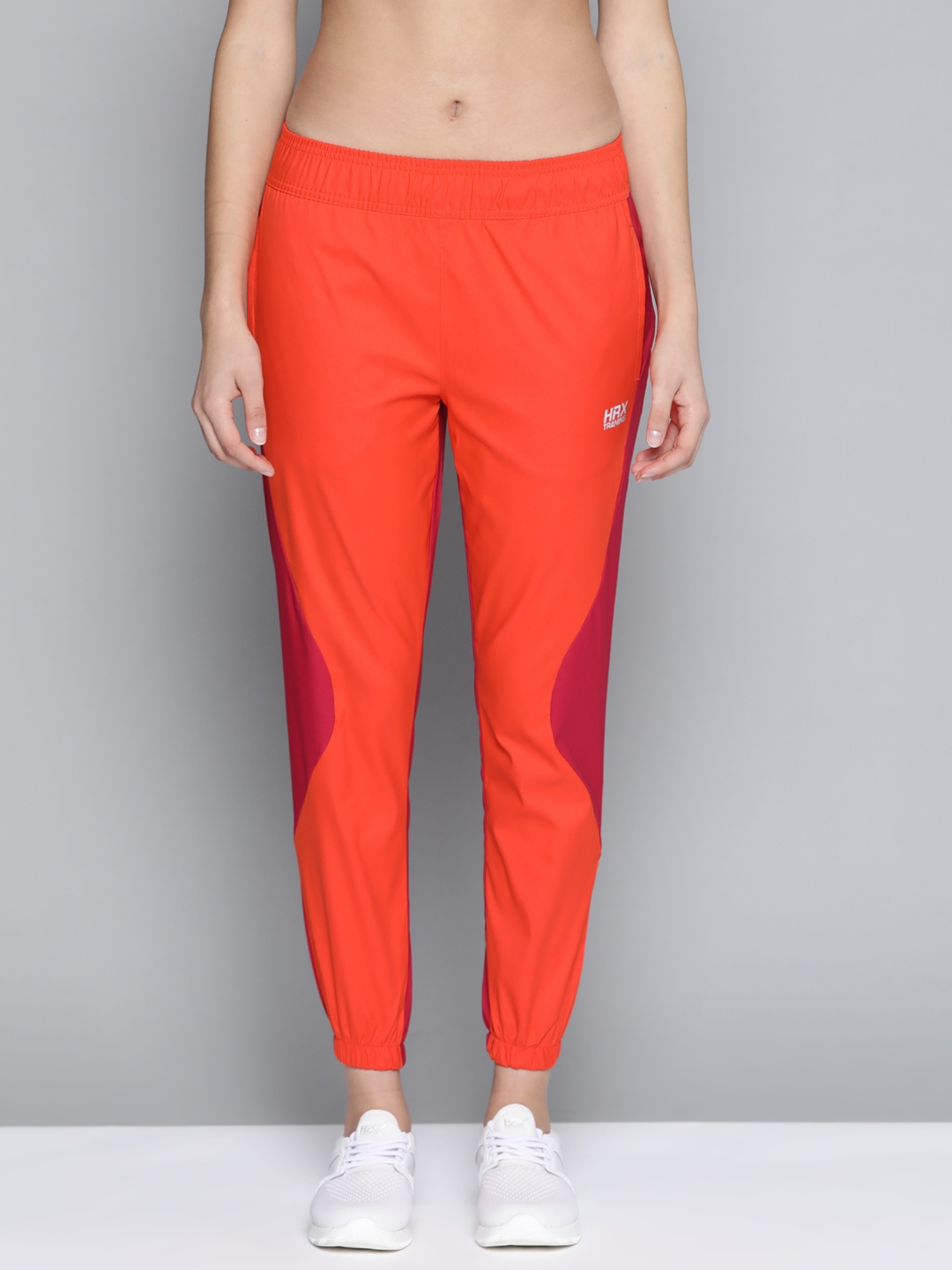 

HRX by Hrithik Roshan Training Women Oxyfire Rapid-Dry Colourblock Joggers, Orange