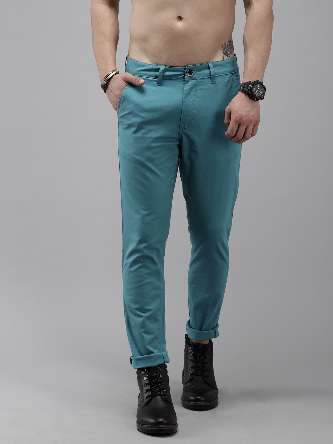 

Roadster Men Teal Solid Slim Fit Mid-Rise Regular Trousers