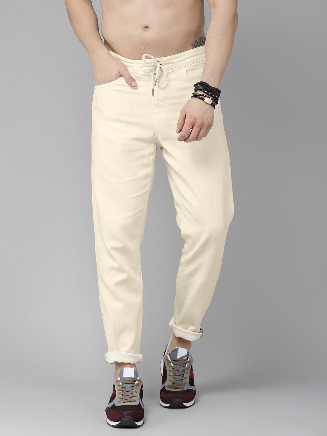 

Roadster Men Beige Textured Mid Rise Cotton Trousers