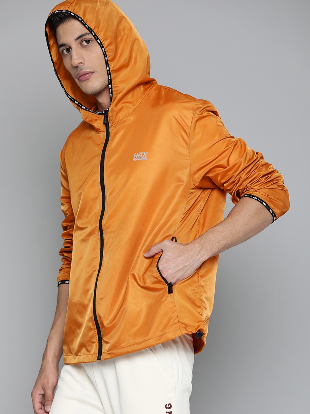 

HRX By Hrithik Roshan Running Men Orange Packable Solid Jackets, Mustard