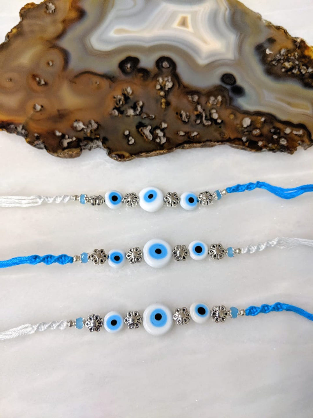 

Digital Dress Room Blue Set of 3 Evil Eye Rakhi with Flower Turkish Charm