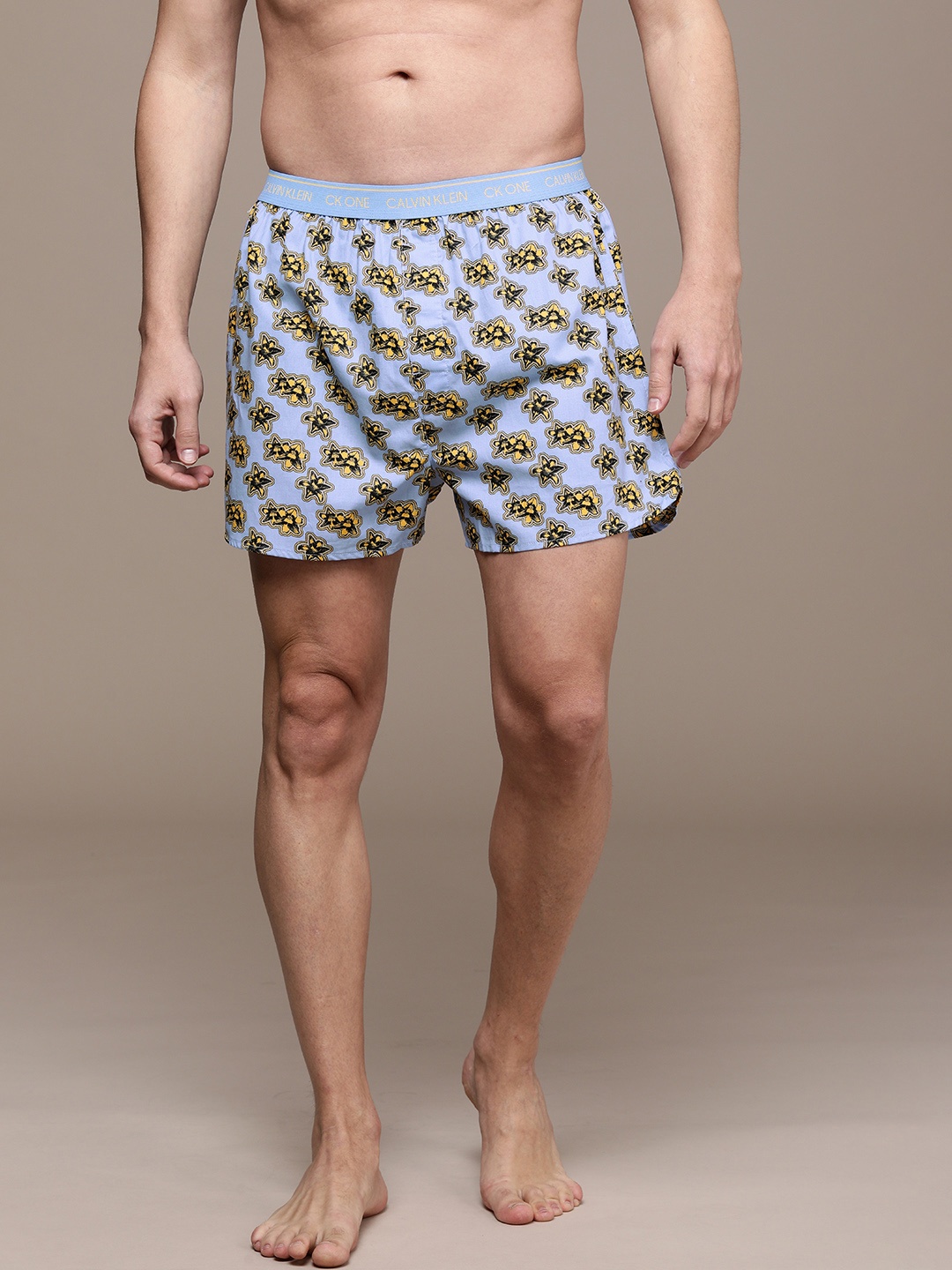 

Calvin Klein Underwear Men Blue And Yellow Printed Mid-Rise Boxers NB2998V3Z