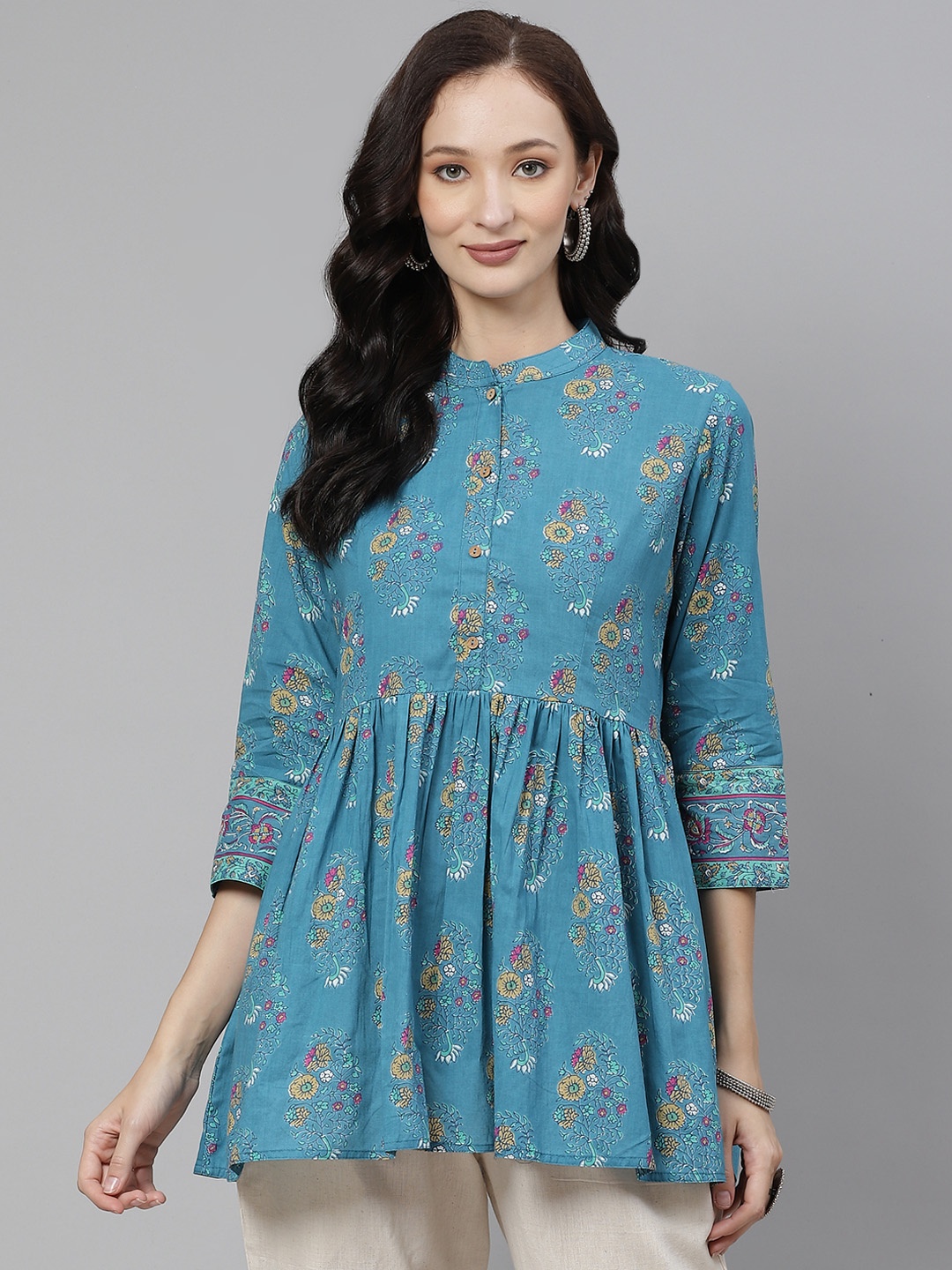 

Divena Teal Blue & Mustard Yellow Pure Cotton Printed Mandarin Collar A-Line Top
