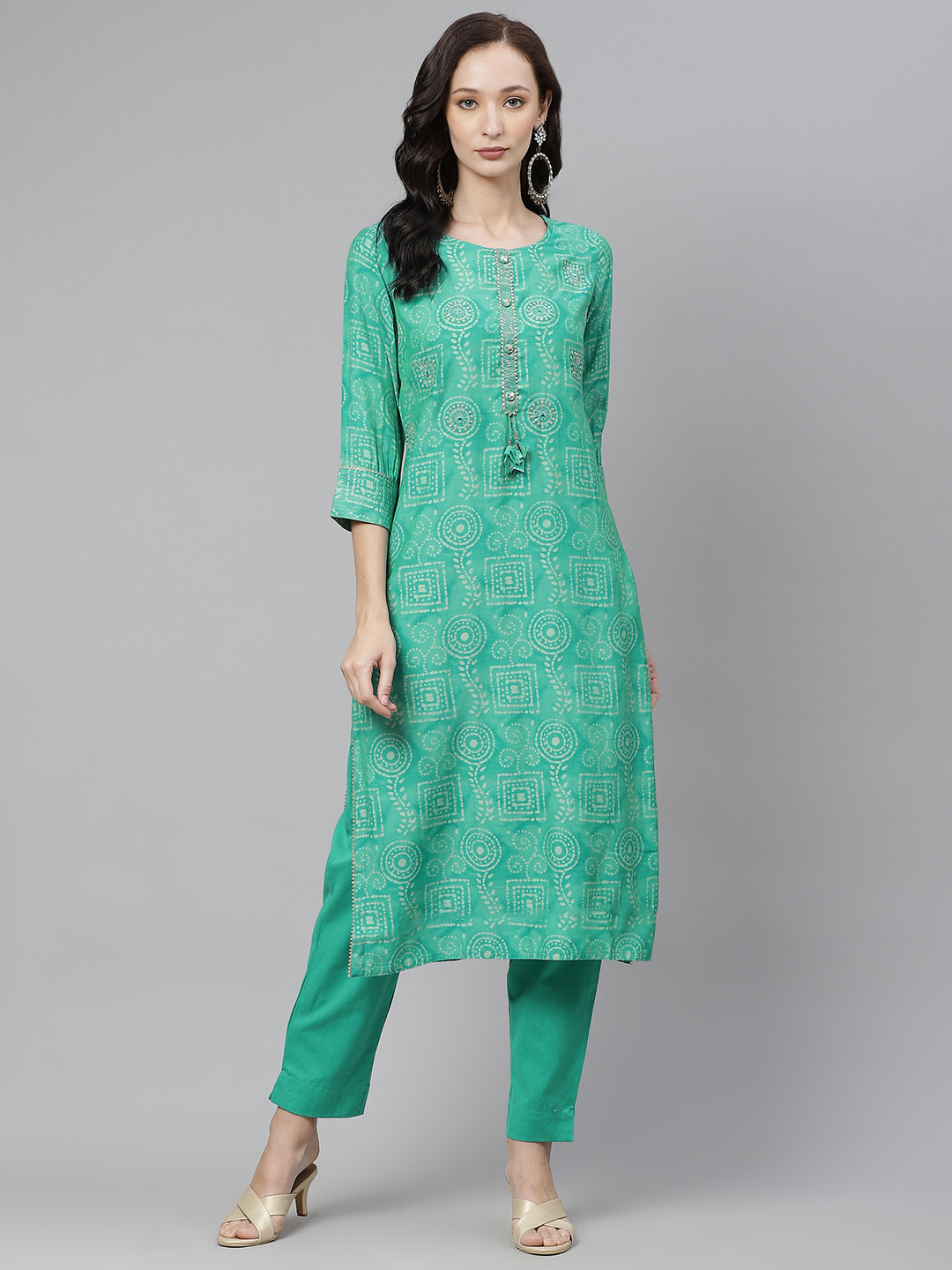 

Divena Women Green & Off White Printed Mirror Work Kurta with Trousers