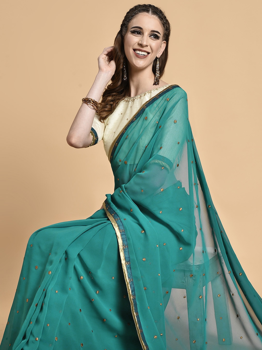 

Sangria Teal & Beige Embellished Embroidered Pure Georgette Saree