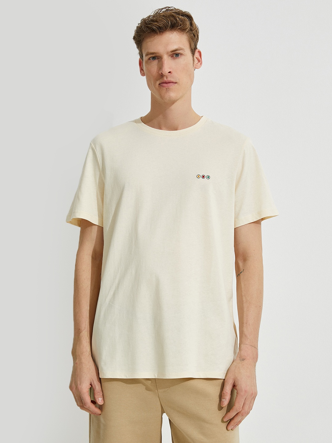 

Koton Men Beige Solid Pure Cotton T-shirt