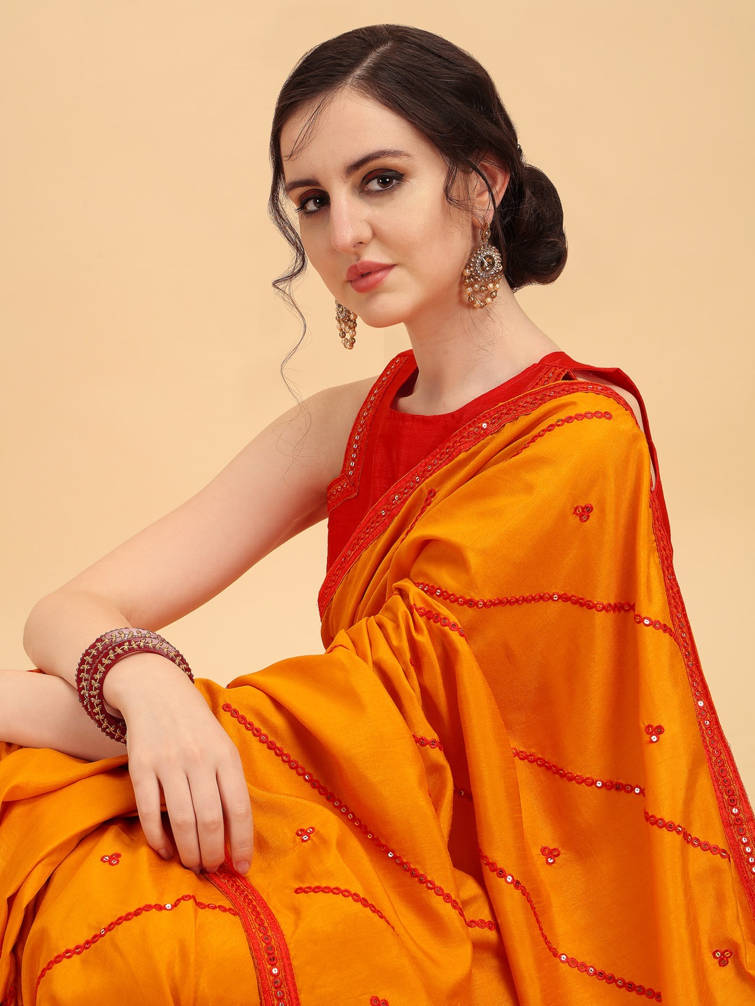

Sangria Mustard & Red Embellished Mirror Work Silk Blend Heavy Work Saree