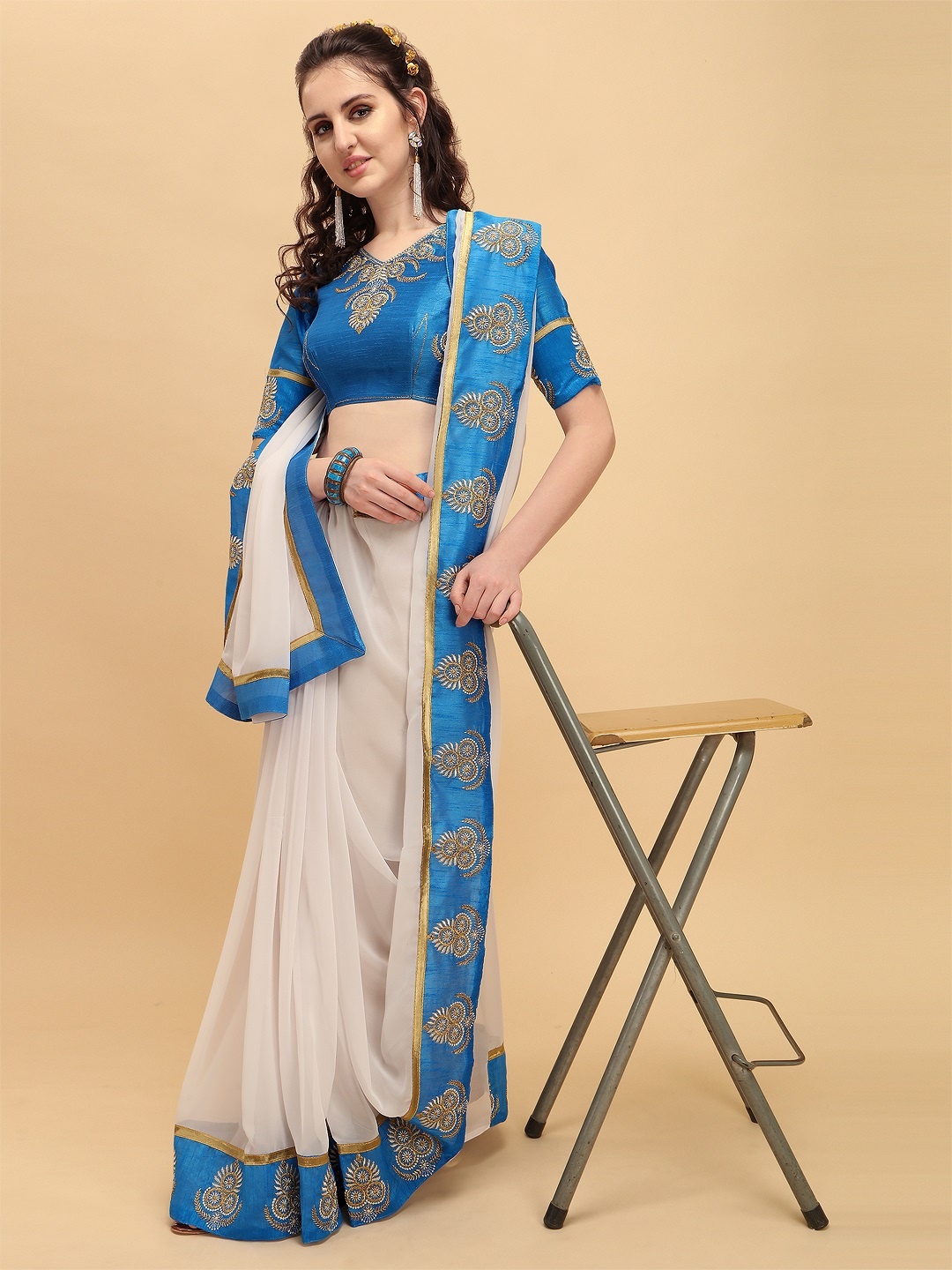 

Sangria White & Blue Embroidered Pure Georgette Saree