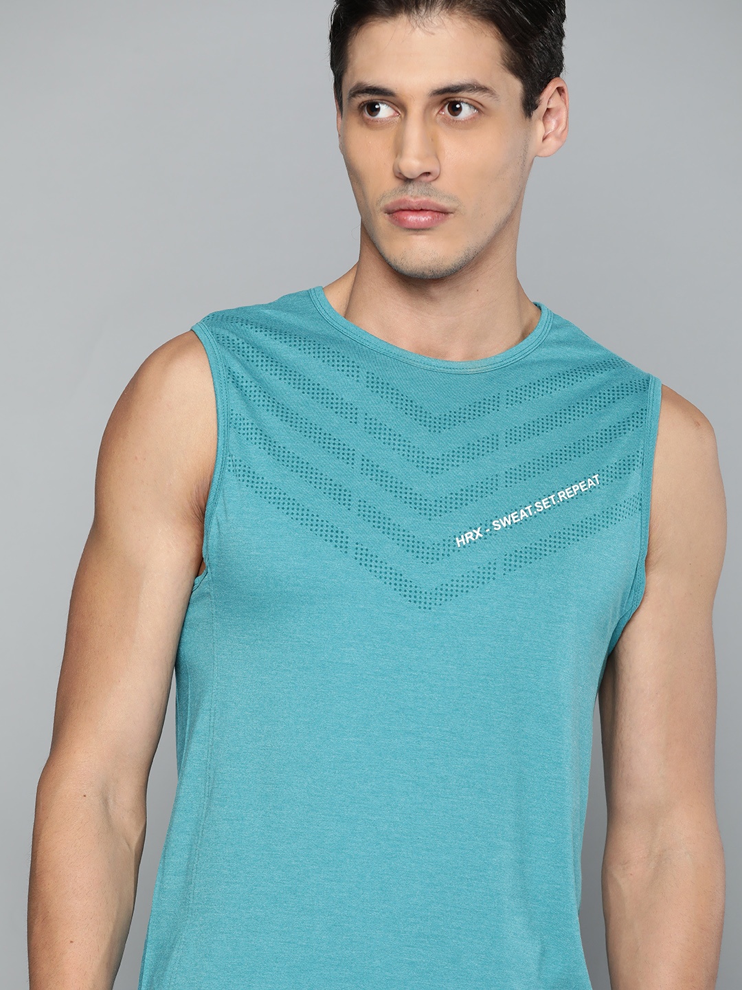 

HRX By Hrithik Roshan Training Men Teal Melange Melange Solid Tshirts, Blue