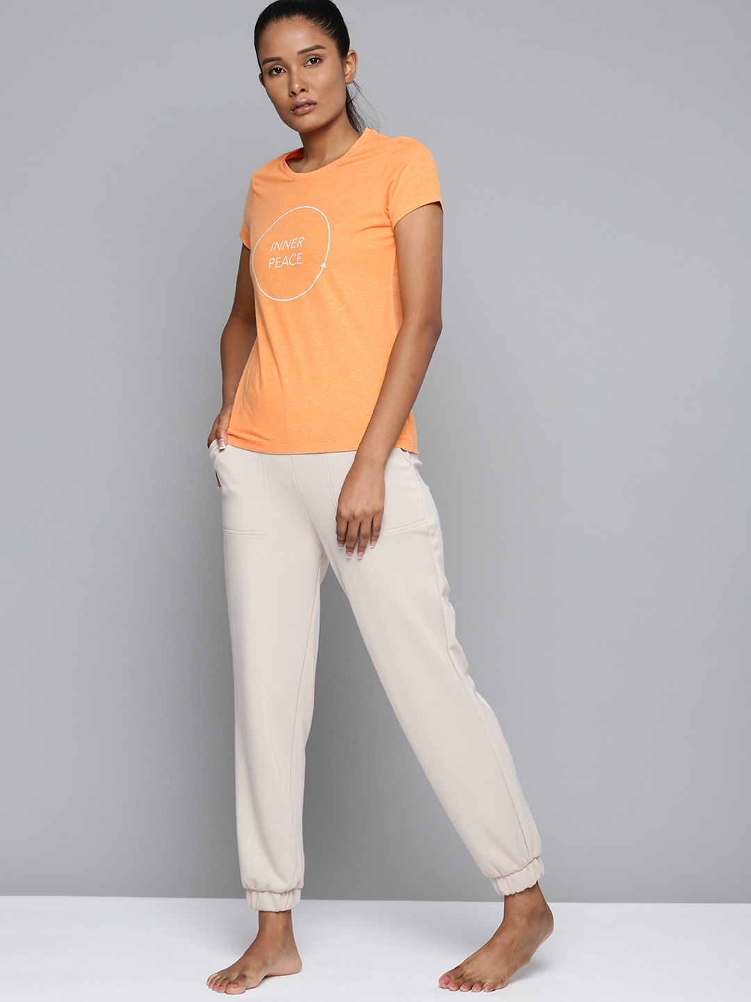 

HRX By Hrithik Roshan Yoga Women Orange Melange Typography Tshirts