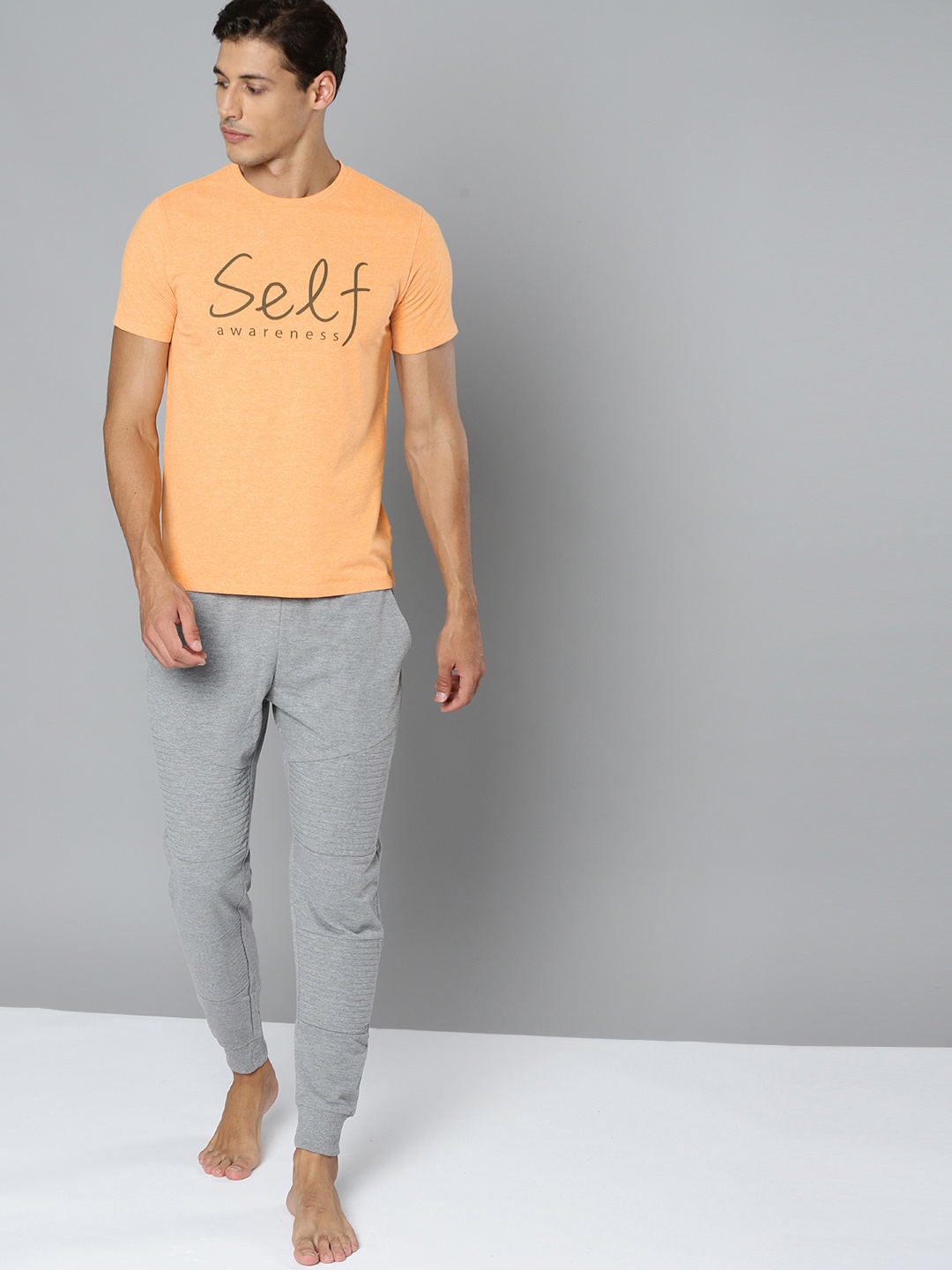 

HRX By Hrithik Roshan Yoga Men Orange Melange Typography Sustainable Tshirt, Peach