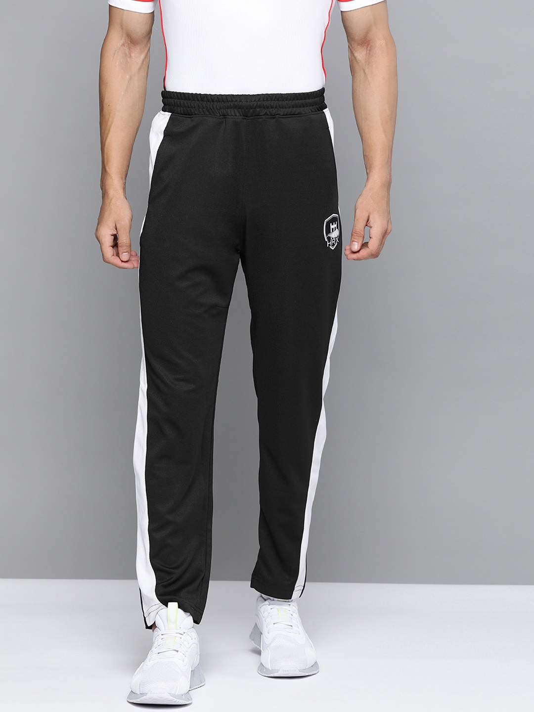 HRX by Hrithik Roshan Men Black Solid Track Pants - buy at the price of ...