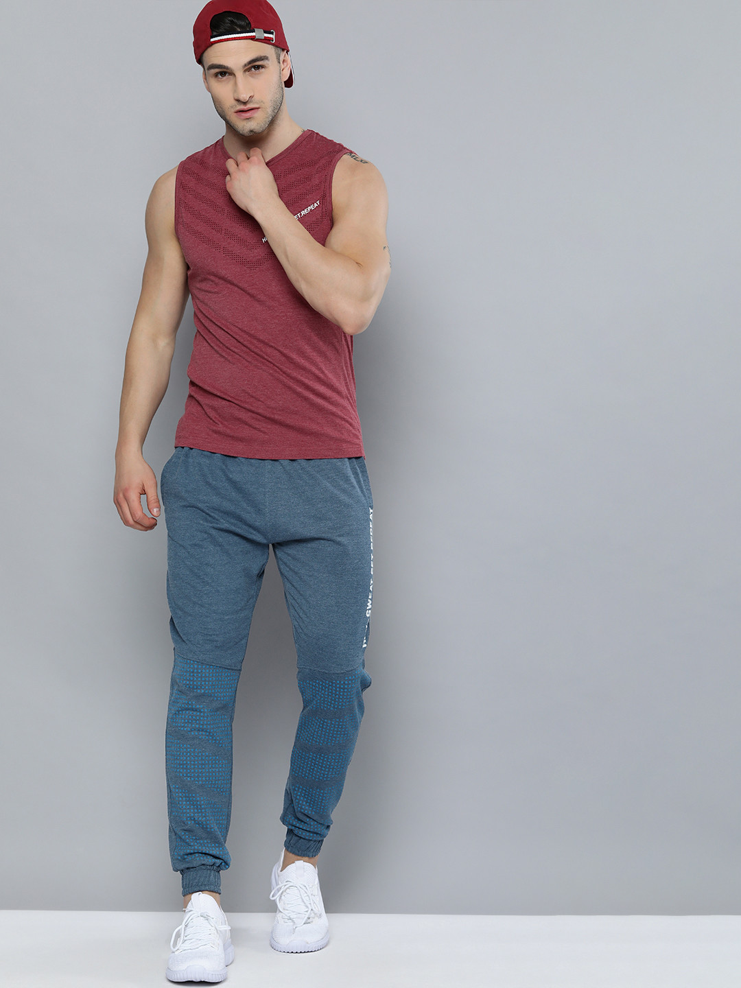 

HRX By Hrithik Roshan Training Men Blue Melange Typography Print Joggers