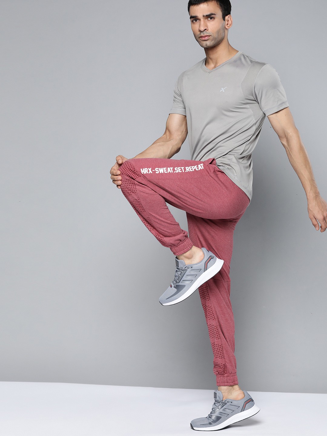 

HRX By Hrithik Roshan Training Men Red Melange Typography Print Joggers