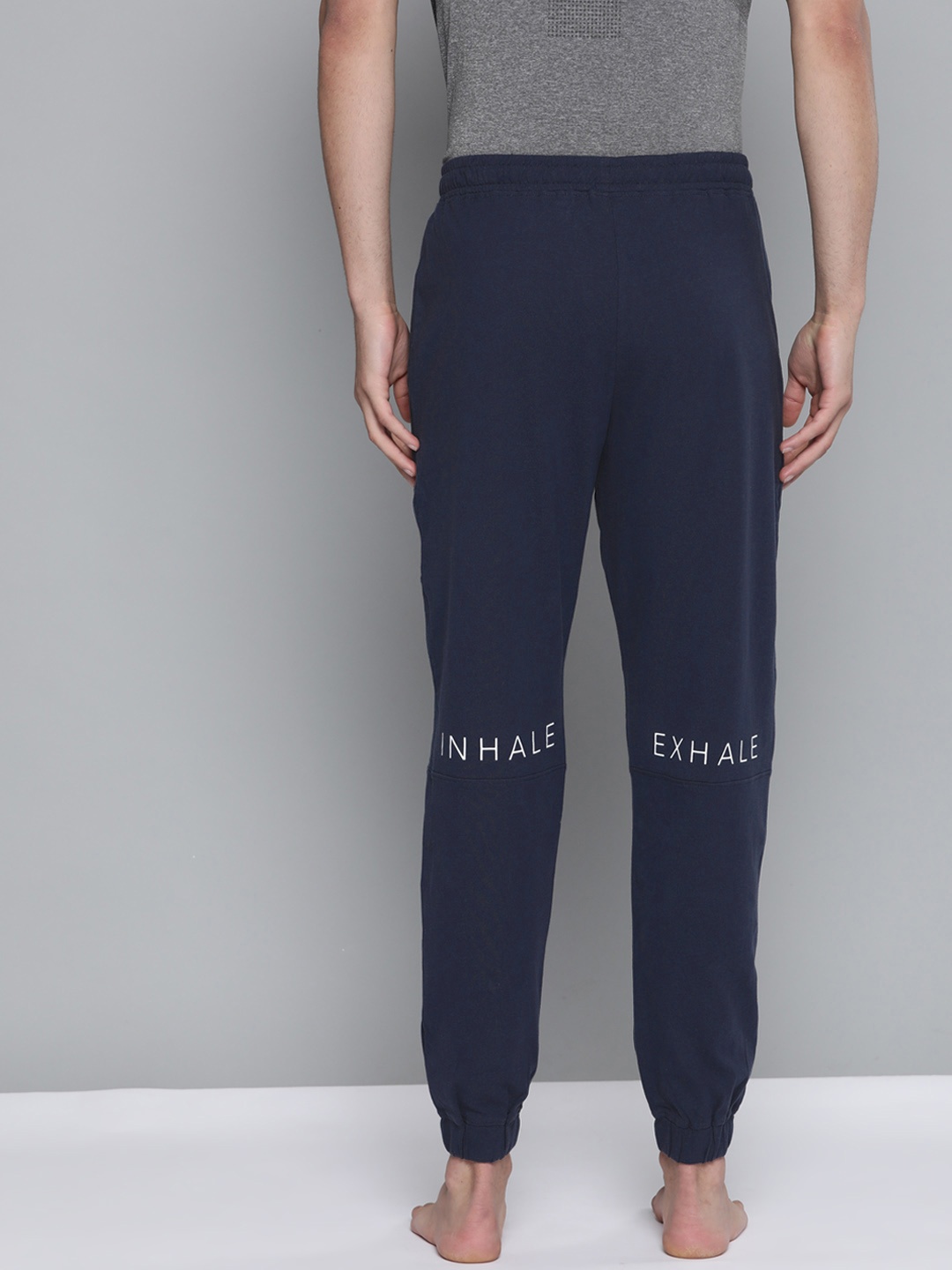 

HRX By Hrithik Roshan Men Navy Blue Pure Cotton Rapid-Dry Typography Yoga Sustainable Track Pants