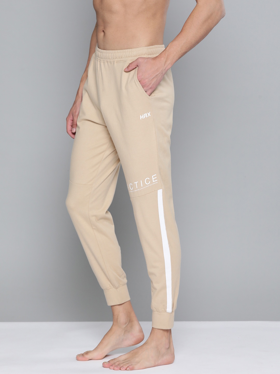 

HRX By Hrithik Roshan Yoga Men Myrobolan Rapid-Dry Colourblock Sustainable Joggers, Beige