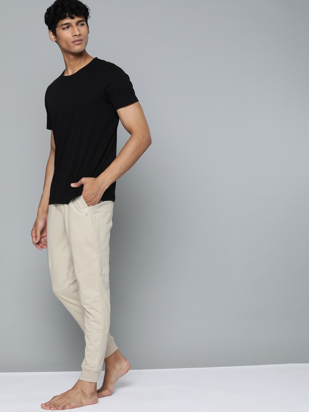 

HRX By Hrithik Roshan Yoga Men Oatmeal Melange Organic Cotton Sustainable Track Pants, Beige