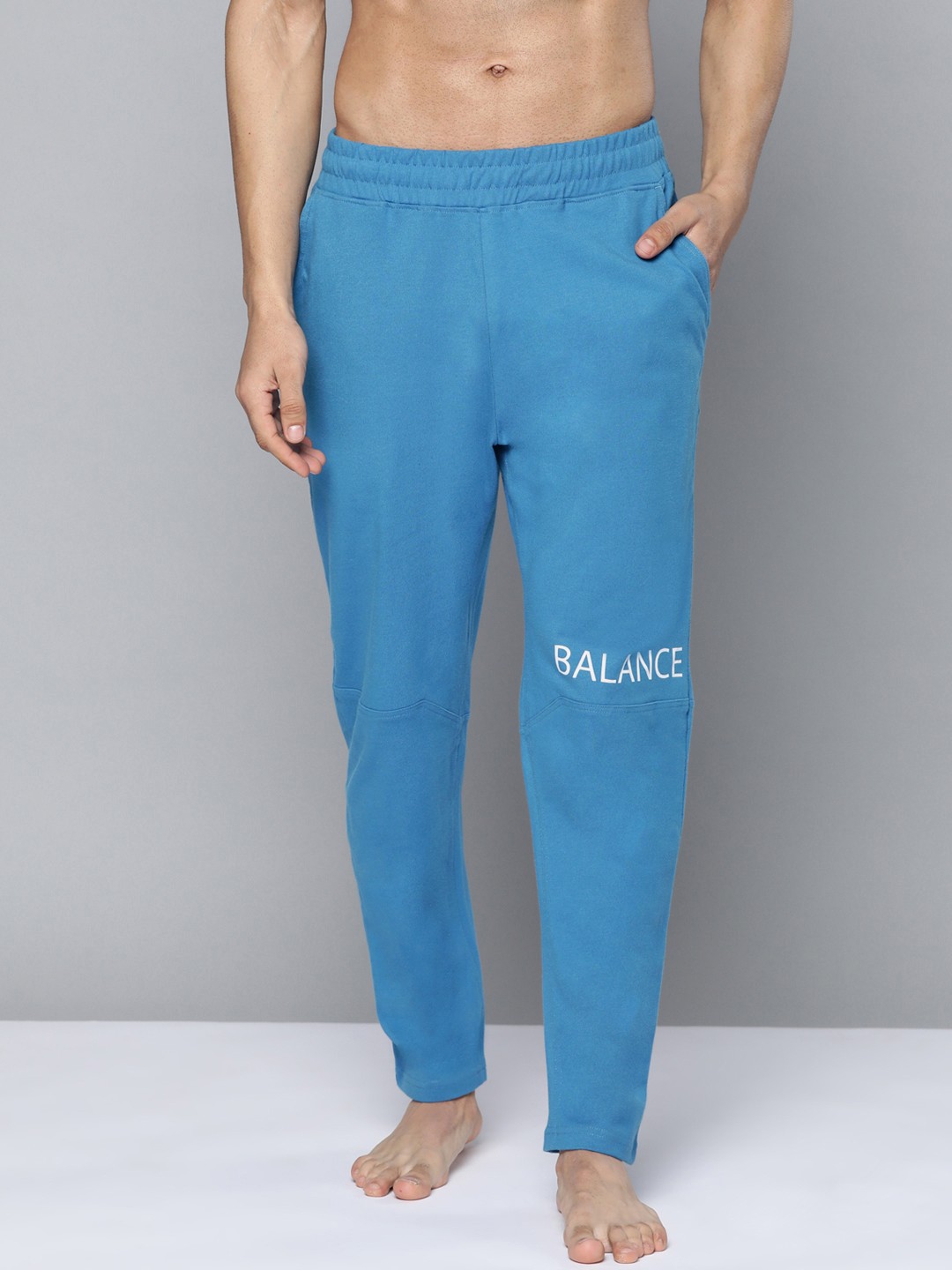 

HRX By Hrithik Roshan Yoga Men Atlantic Blue Rapid-Dry Solid Sustainable Track Pants