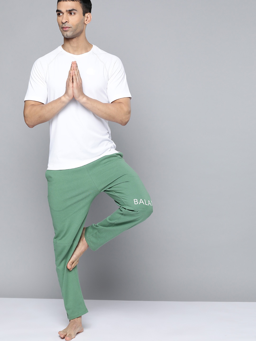 

HRX By Hrithik Roshan Yoga Men Wavellite Rapid-Dry Solid Sustainable Track Pants, Green