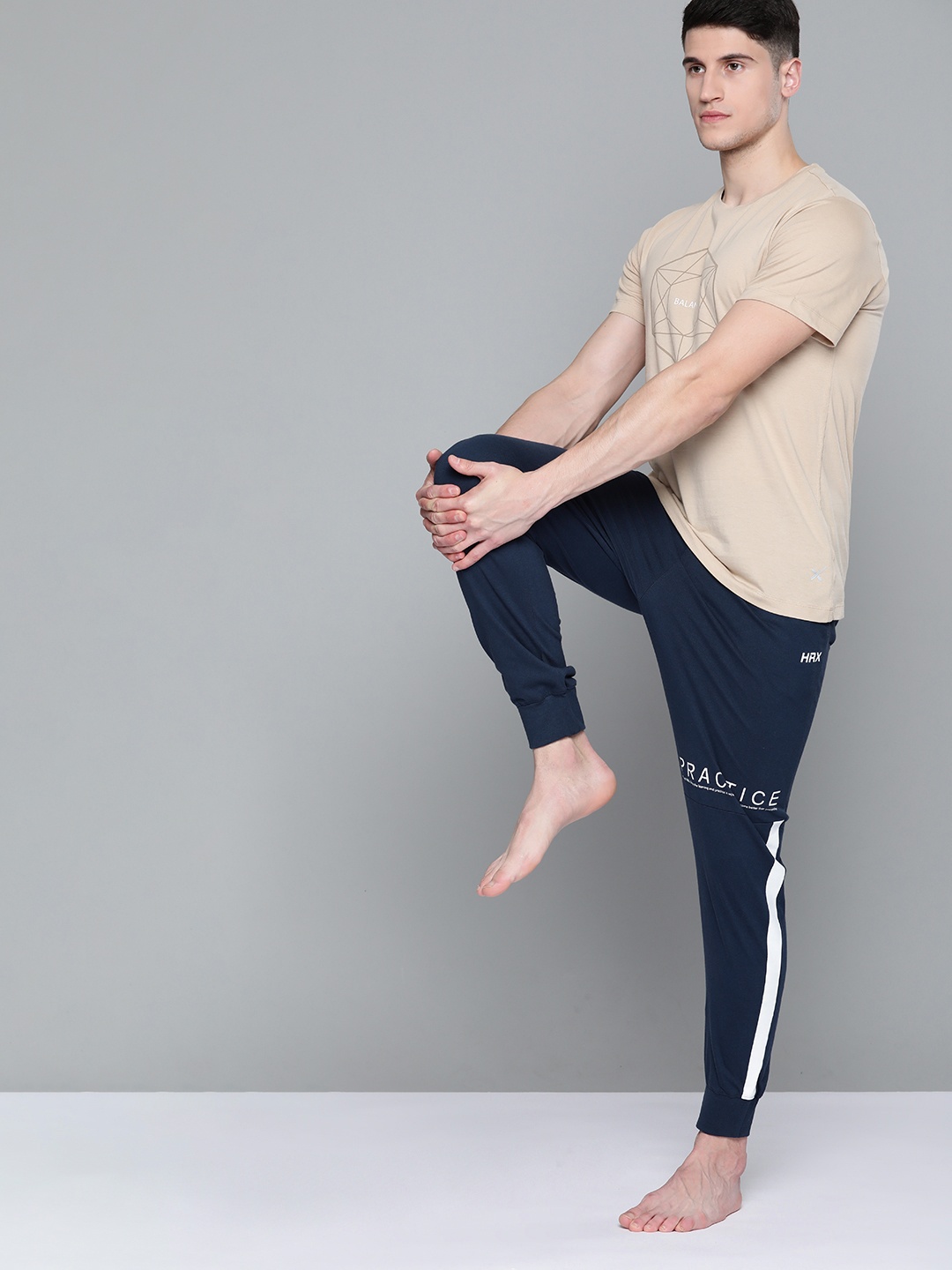 

HRX By Hrithik Roshan Yoga Men Iron Rapid-Dry Printed Detail Sustainable Joggers, Navy blue