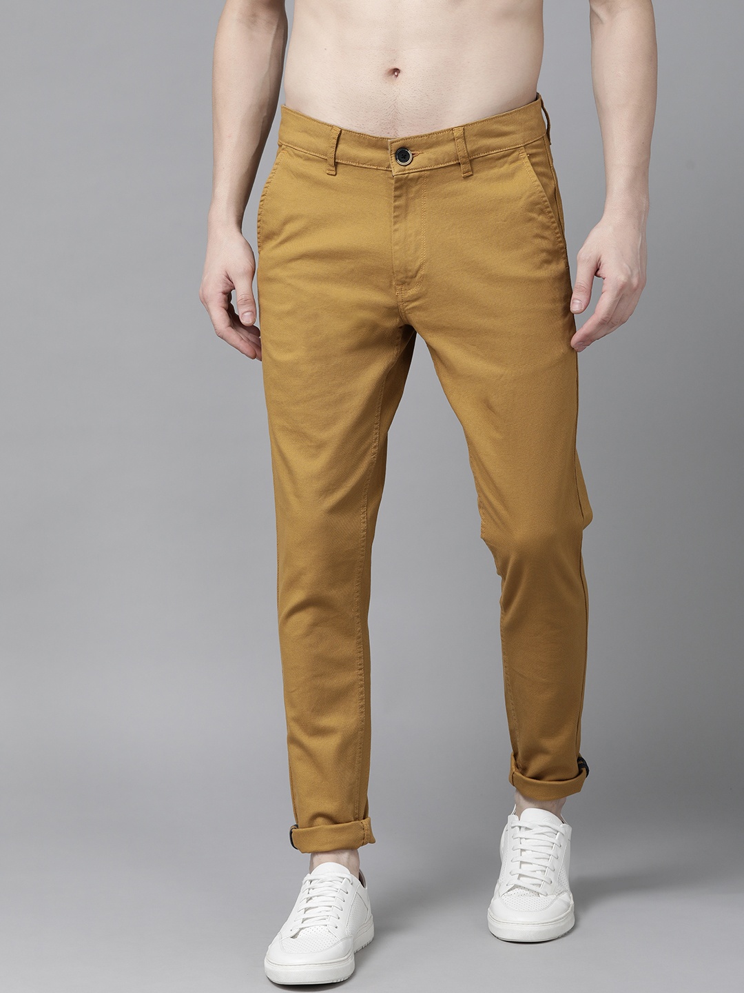 

Roadster Men Khaki Self Design Trousers