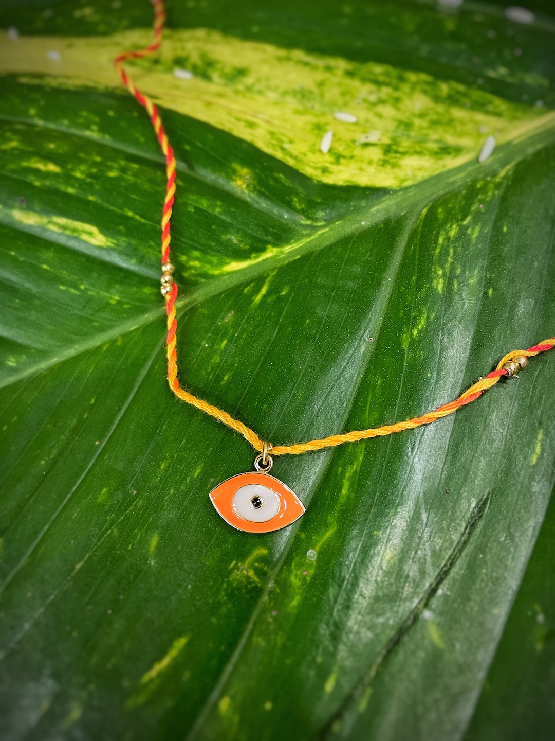 

Digital Dress Room Orange Evil Eye Designs Rakhi, Red