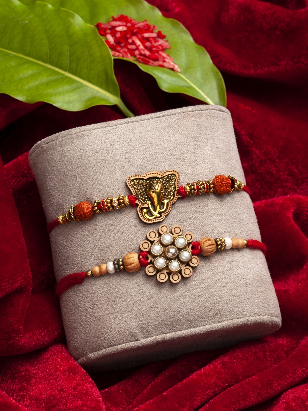 

PANASH Set Of 2 Gold-Toned Floral & Ganpati Rakhis With Roli Chawal