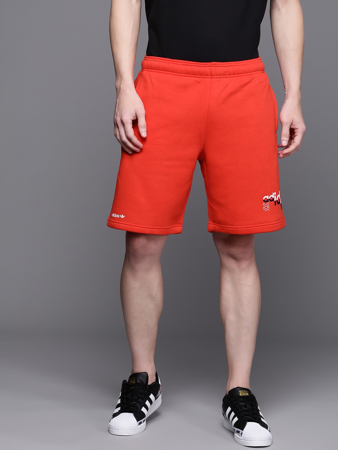 

ADIDAS Originals Men Red Solid Logo Play Shorts