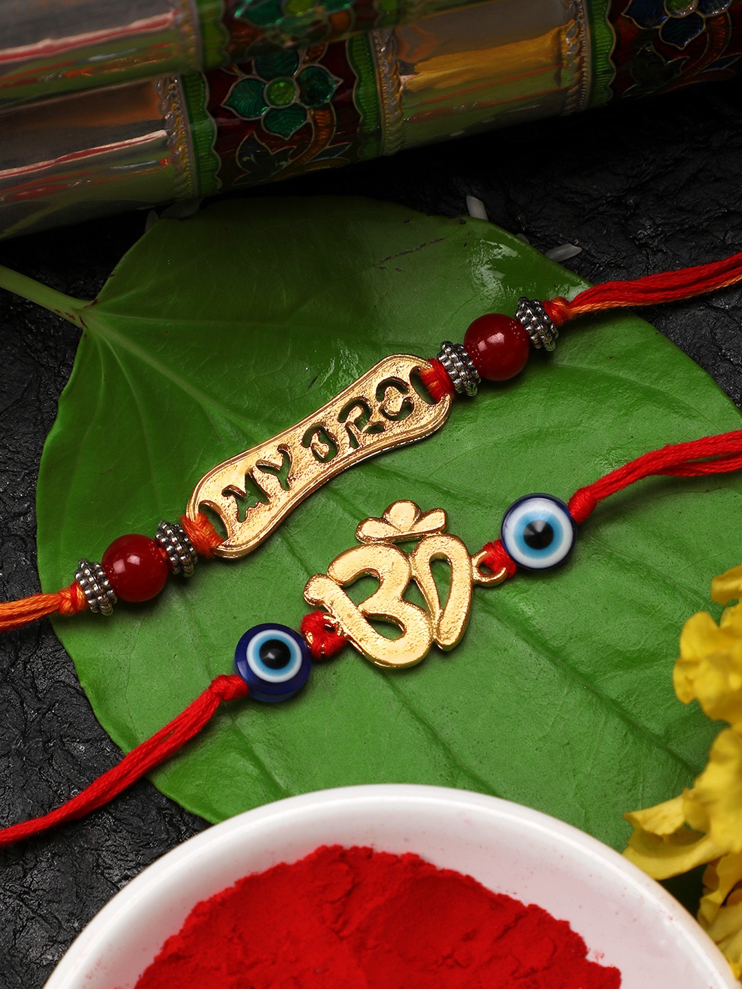 

Yellow Chimes Set of 2 Gold-toned & Red Handmade Om Rakhi with Roli Chawal & Card