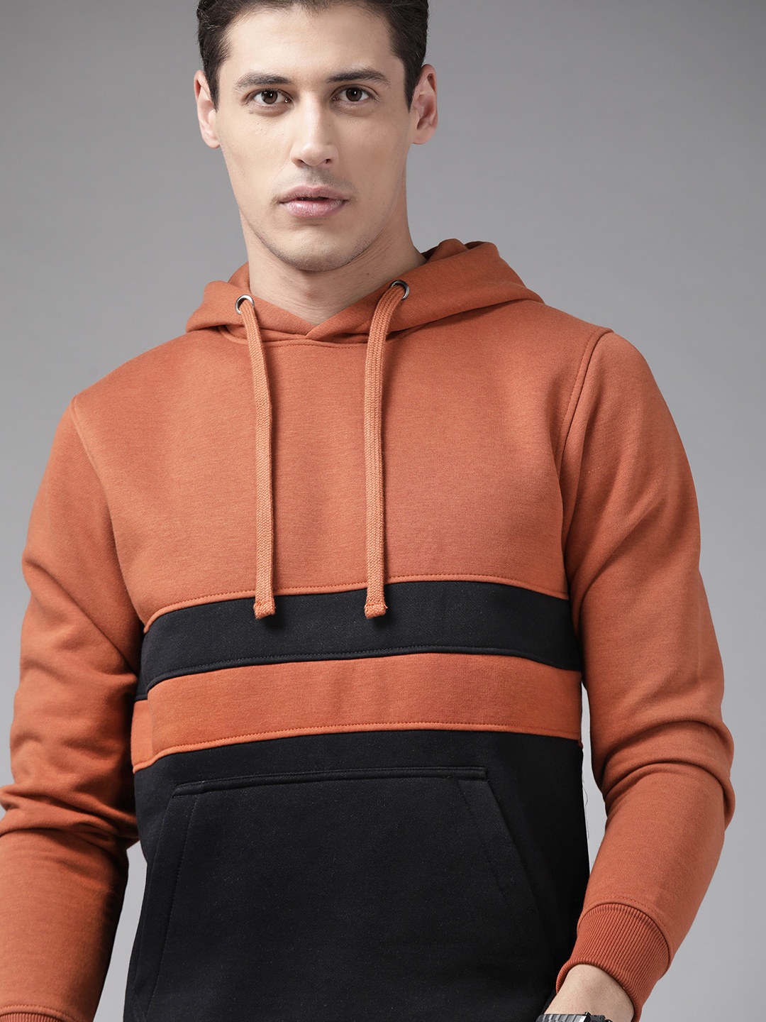 

Roadster Men Rust Brown & Black Colourblocked Hooded Sweatshirt