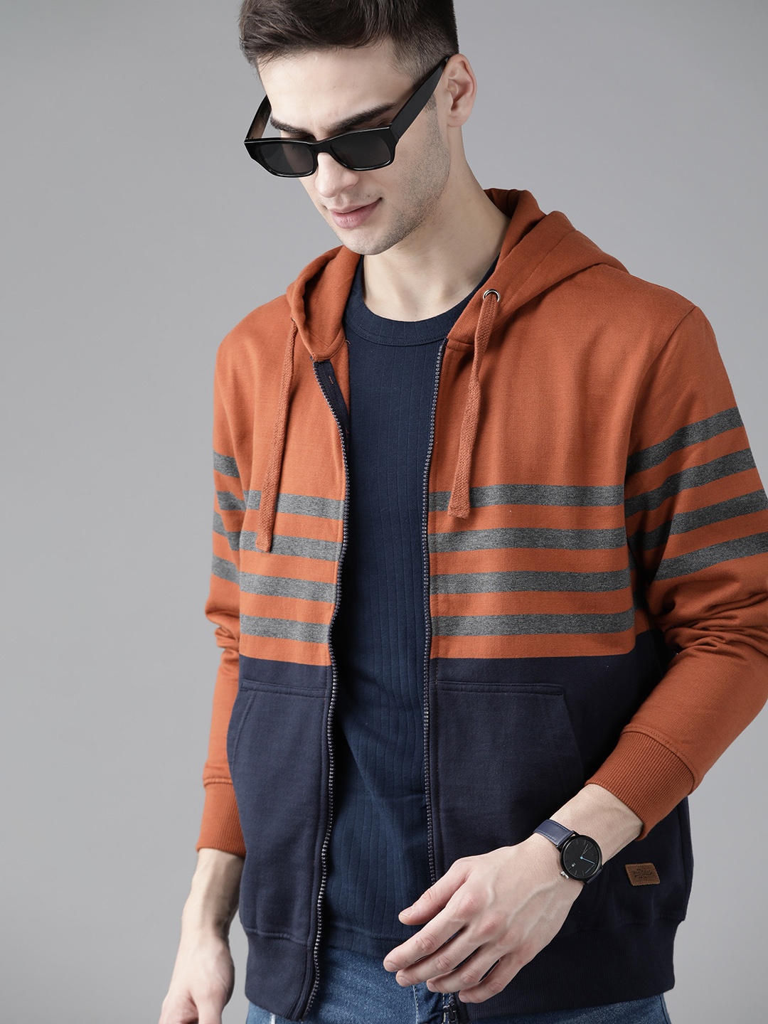 

Roadster Men Rust Orange & Navy Striped Hooded Sweatshirt
