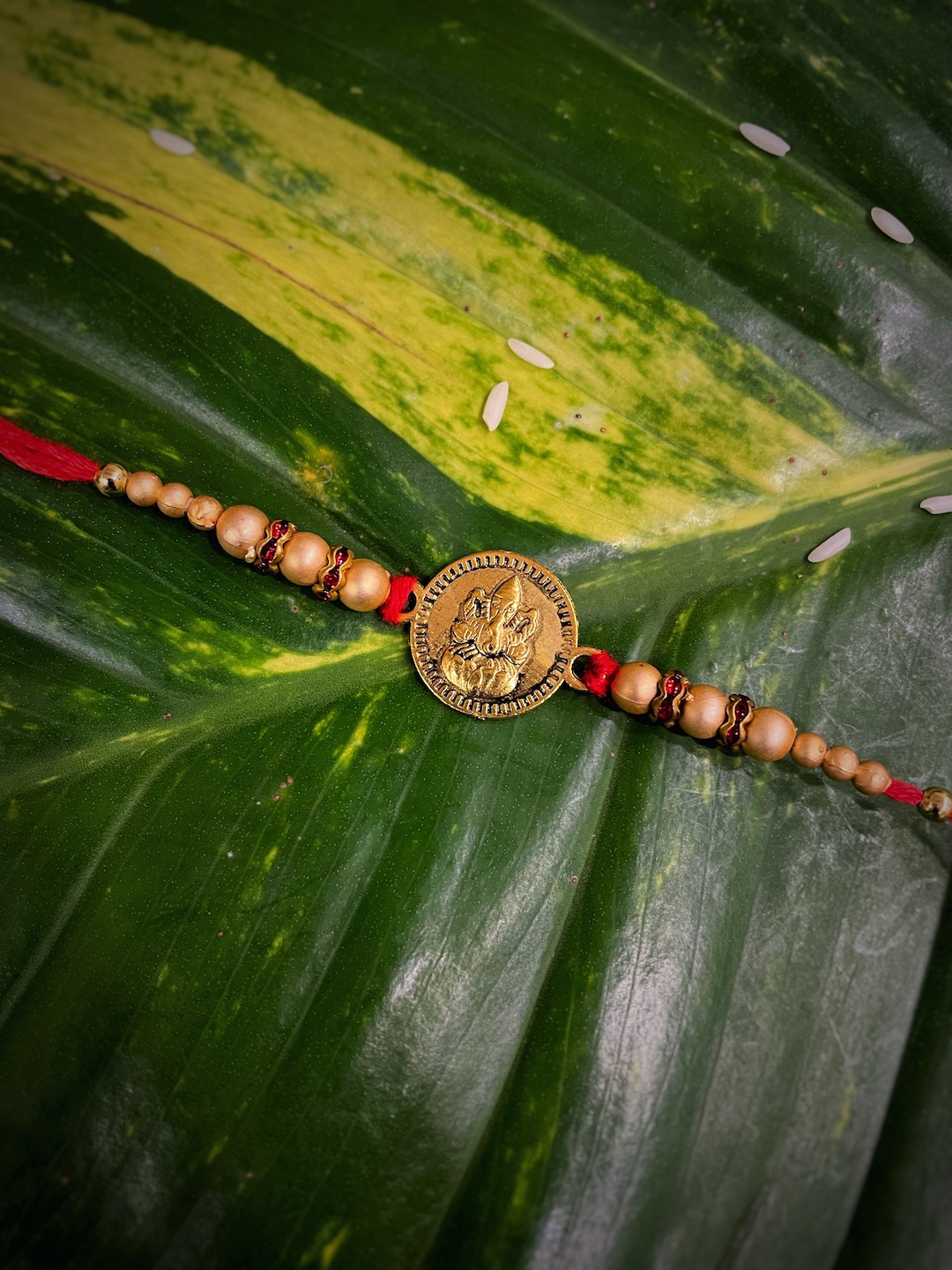 

Digital Dress Room Men Gold Ganesh Ji Beads Rakhi