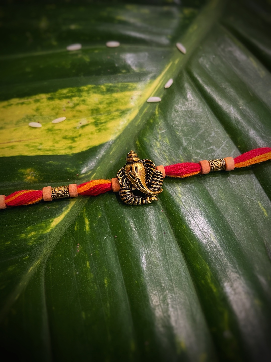 

Digital Dress Room Men Gold & Orange Ganesh Ji Pendant Rakhi