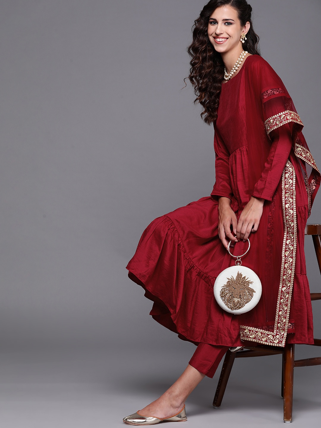 

Inddus Women Maroon & Golden Solid Kurta with Trousers & Dupatta with Embroidered Border