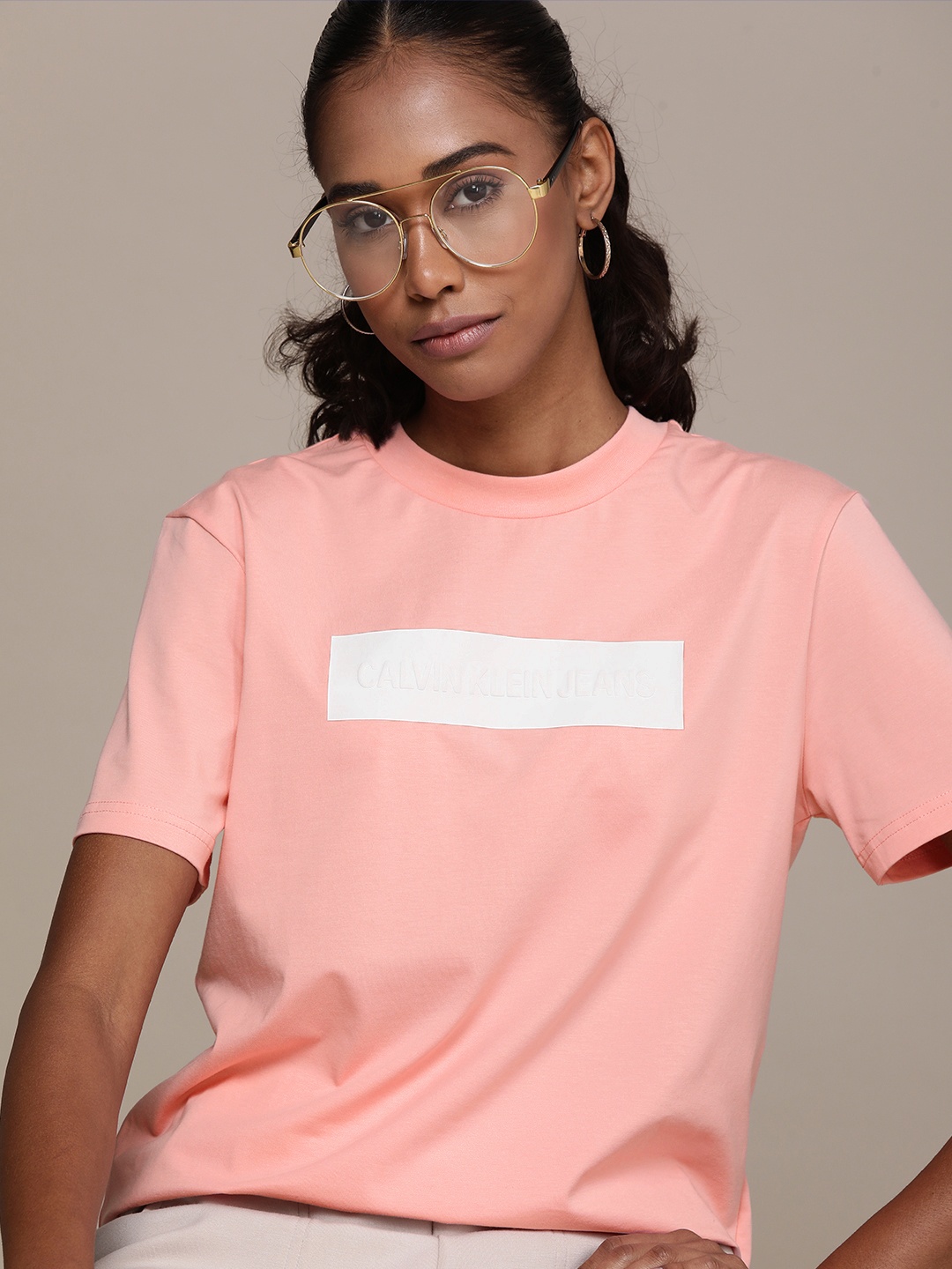 

Calvin Klein Jeans Women Peach-Coloured & White Printed T-shirt