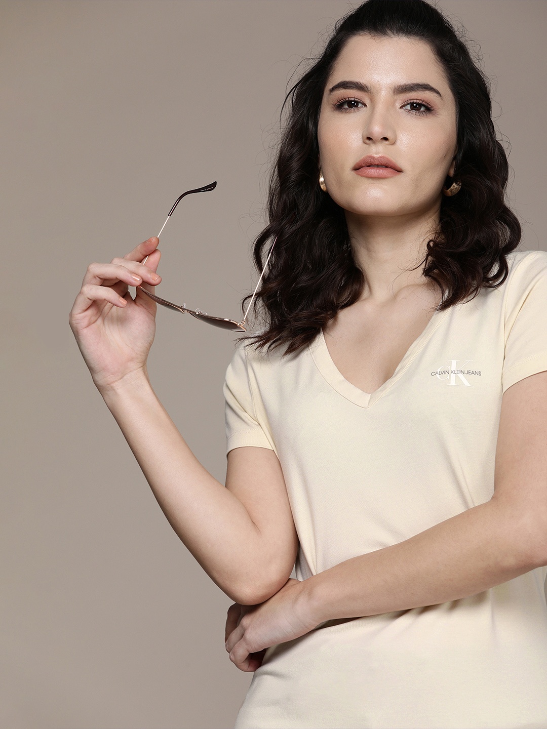 

Calvin Klein Jeans Women Beige Typography V-Neck Slim Fit Pure Cotton T-shirt