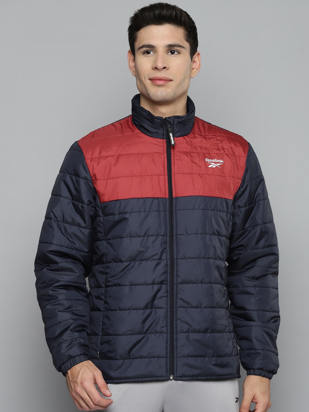

Reebok Men Navy Blue & Red Colourblocked MP Light Padded Jacket