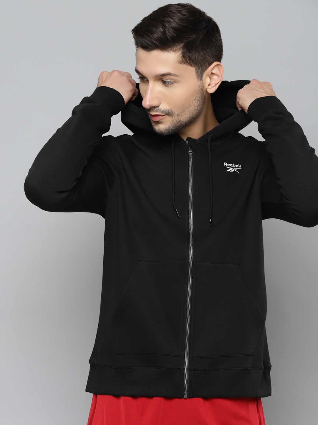

Reebok Men Black RI Fleece FZ Solid Hooded Training Jacket