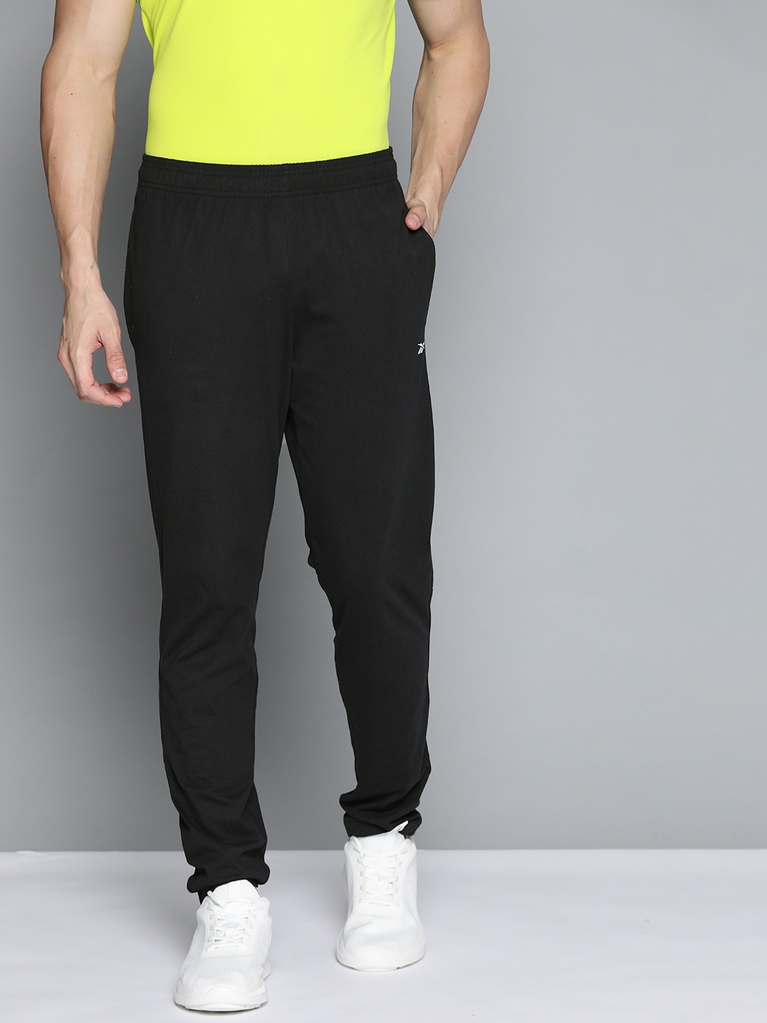 

Reebok Men Black Pure Cotton TE Vec Training Solid Track Pants