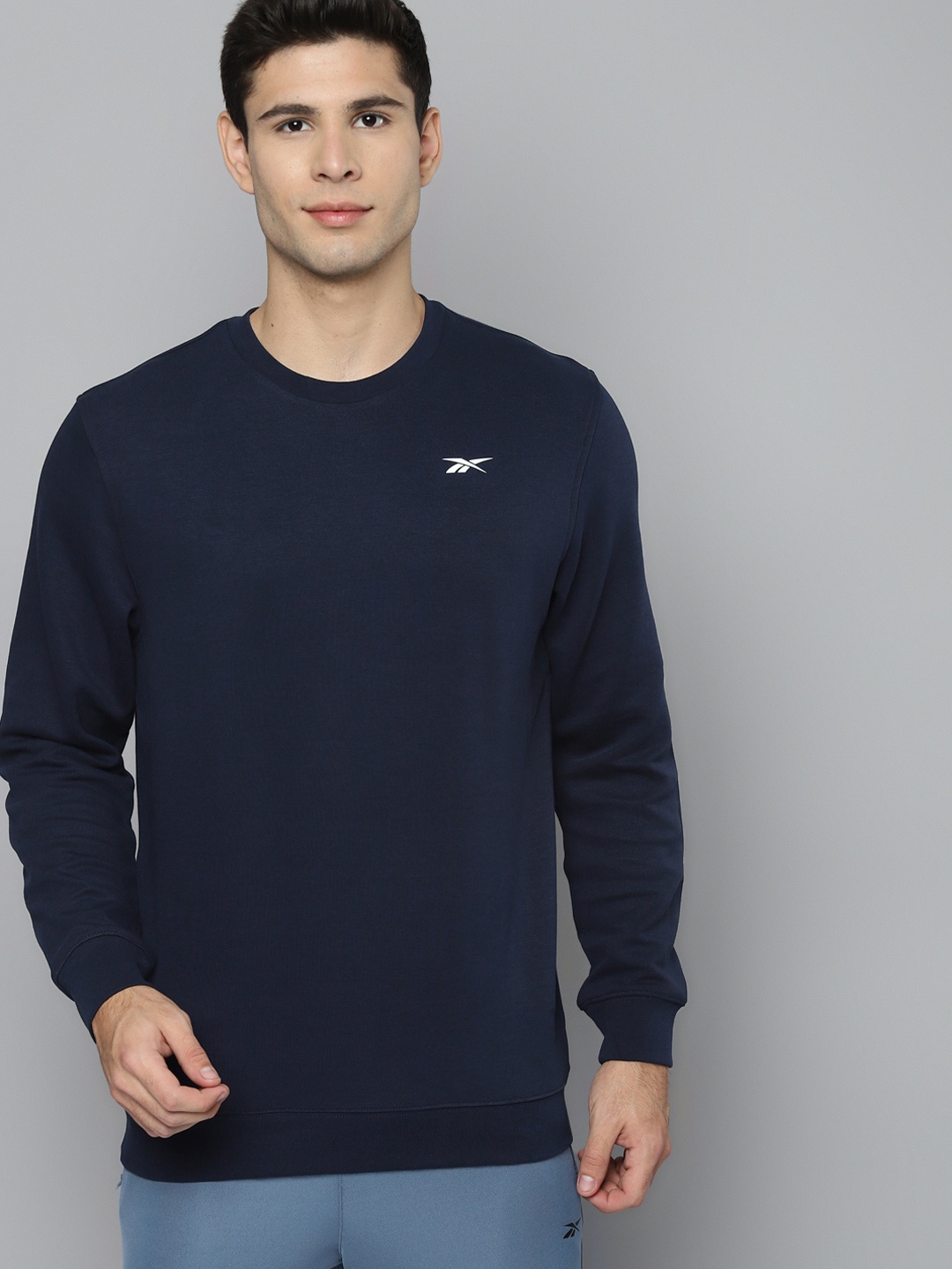 

Reebok Men Navy Blue Solid Workout Training Sweatshirt
