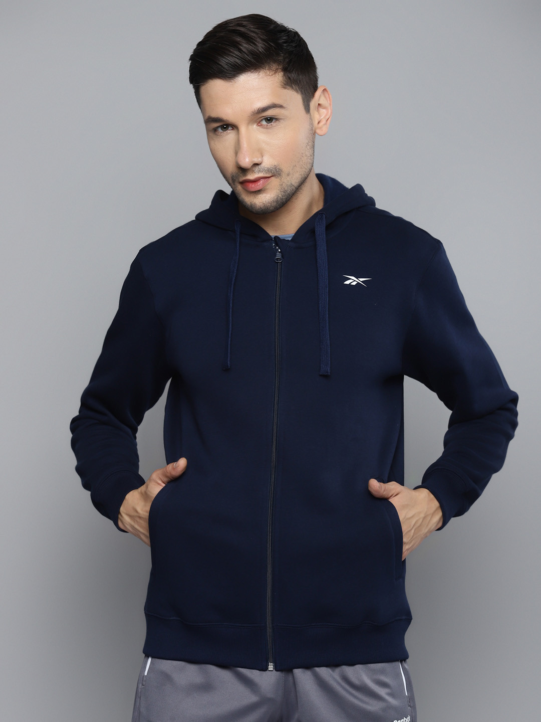 

Reebok Men Navy Blue Solid FND Hooded Sweatshirt