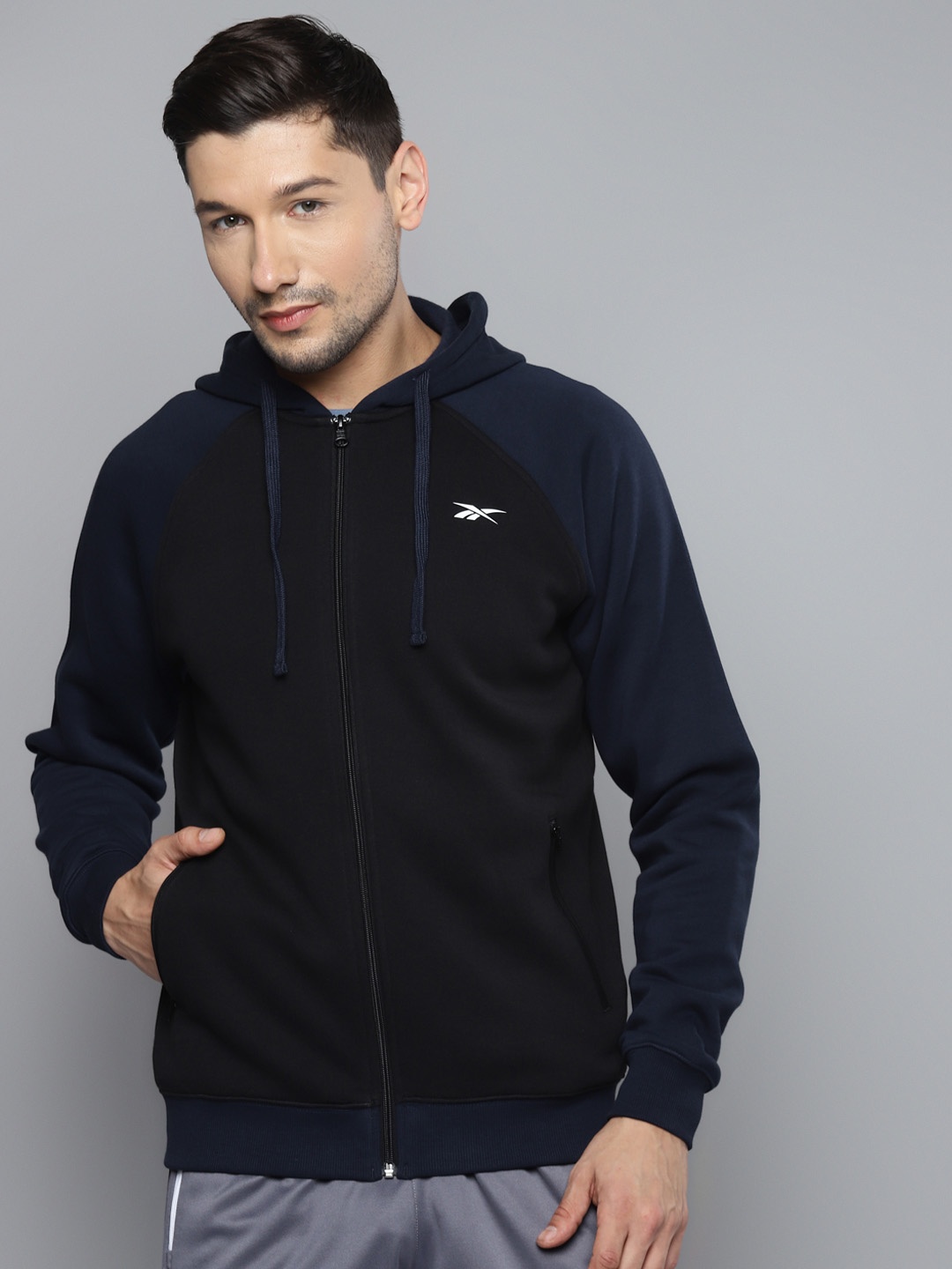 

Reebok Men Black & Navy Blue Solid Performance Hooded Sweatshirt