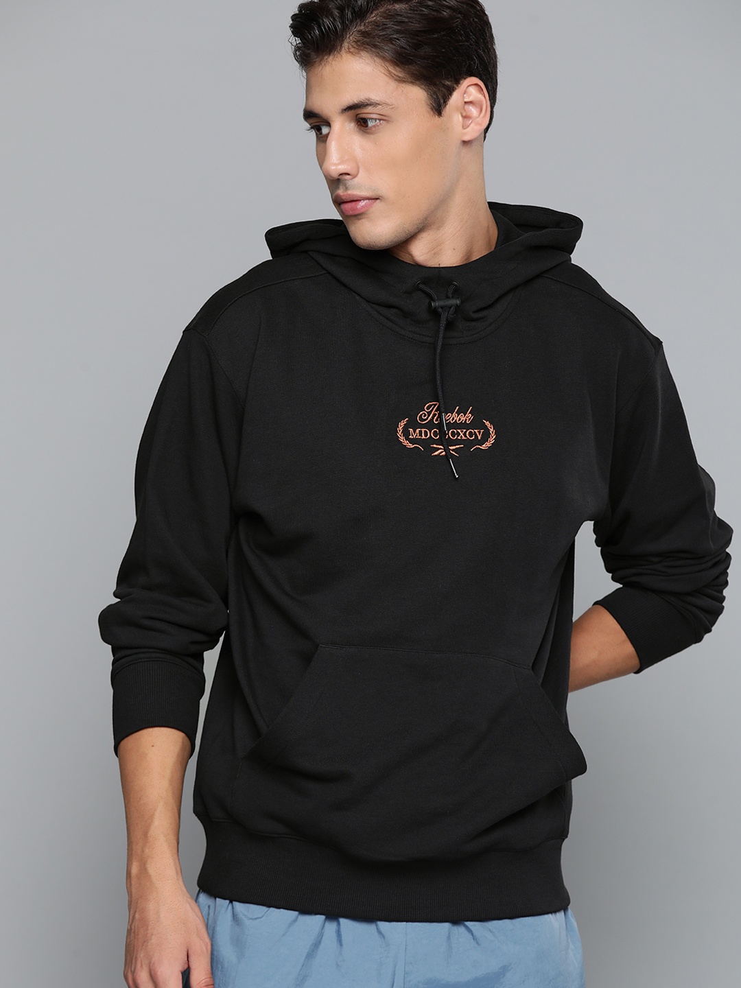 

Reebok Classic Men Black Solid Cotton Golf Graphic Hooded Sweatshirt