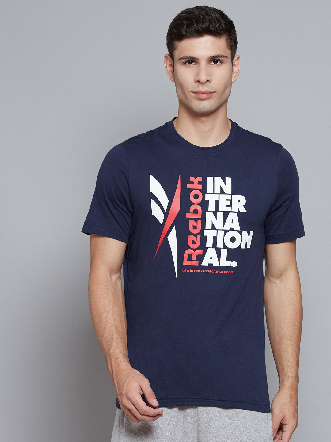 

Reebok Men Navy Blue & White Typography Print Verbiage Graphic Cotton Slim Fit T-shirt